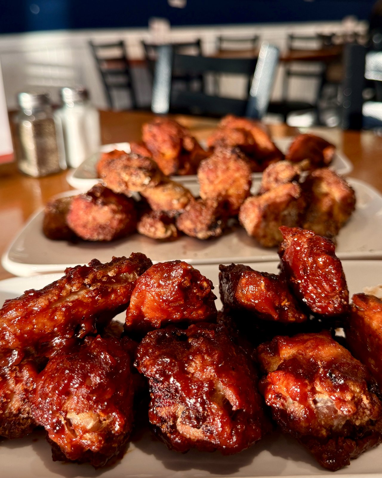 Wings tossed in BBQ sauce and dry rub, hand-breaded chicken at OV Burger Bar Prince Rupert
