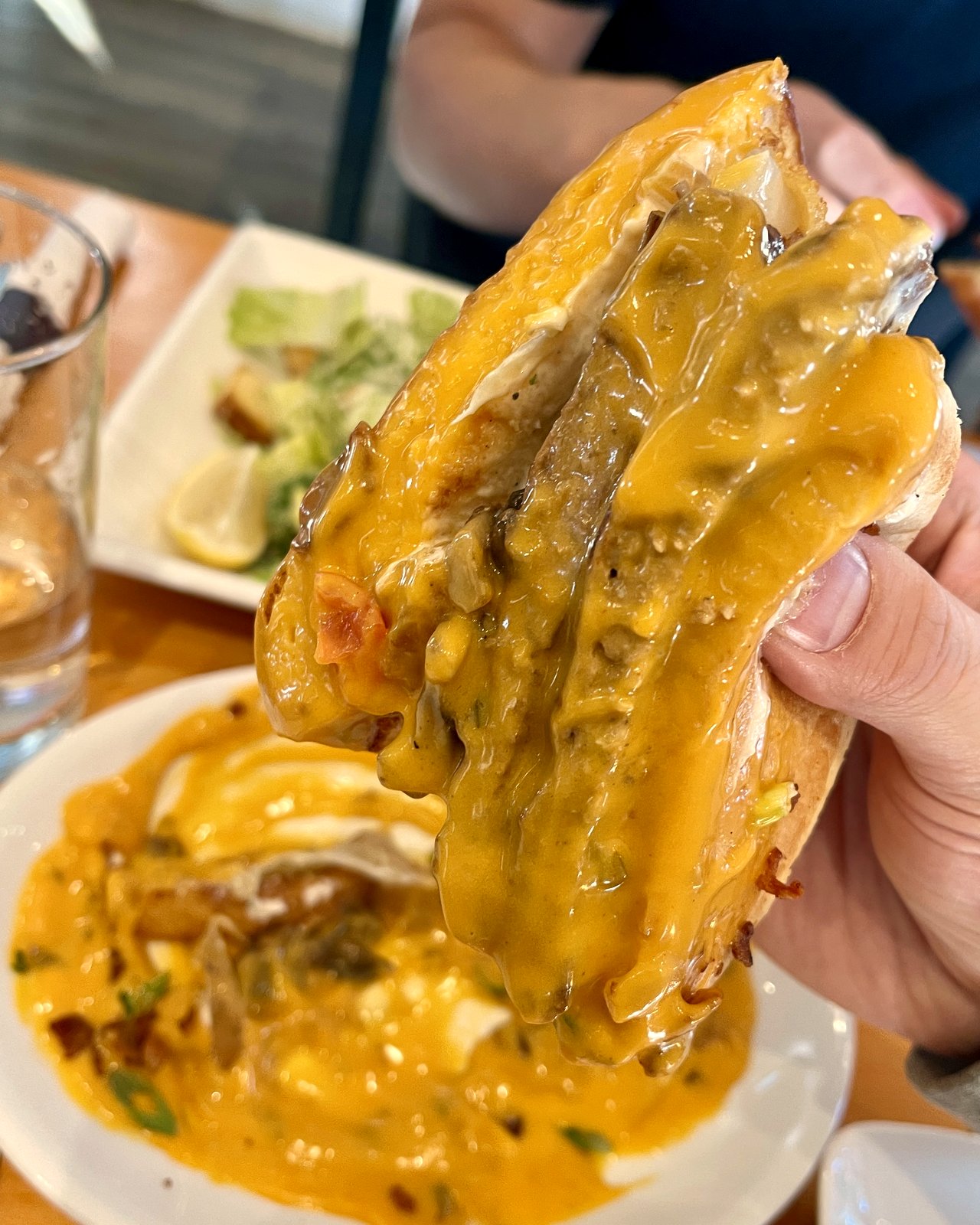 Queso Royale Burger of the Month with cascading nacho cheese, OV Burger Bar Prince Rupert