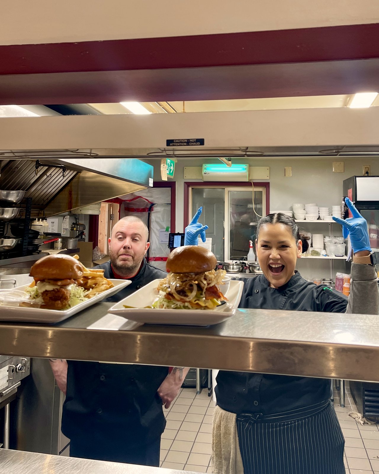 Kitchen lead Bonnie celebrates a service with the kitchen team at OV Burger Bar Prince Rupert