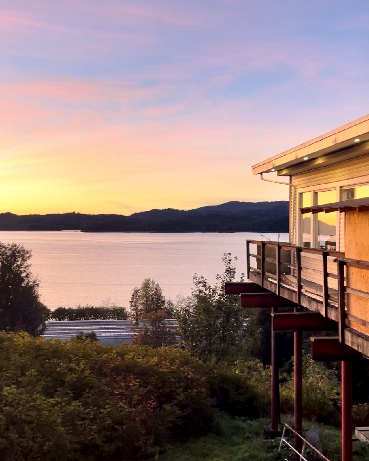 Sunset over Prince Rupert harbour, seen from the deck at OV Burger Bar inside the historic Ocean View Hotel