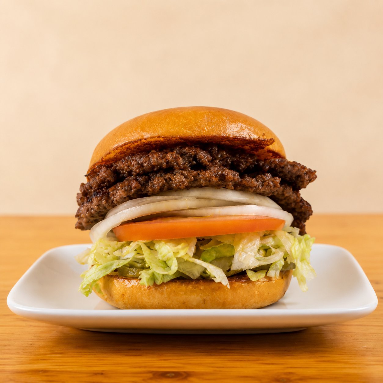 The OV Classic Hamburger with smashed patty, lettuce, tomato and onion, OV Burger Bar Prince Rupert